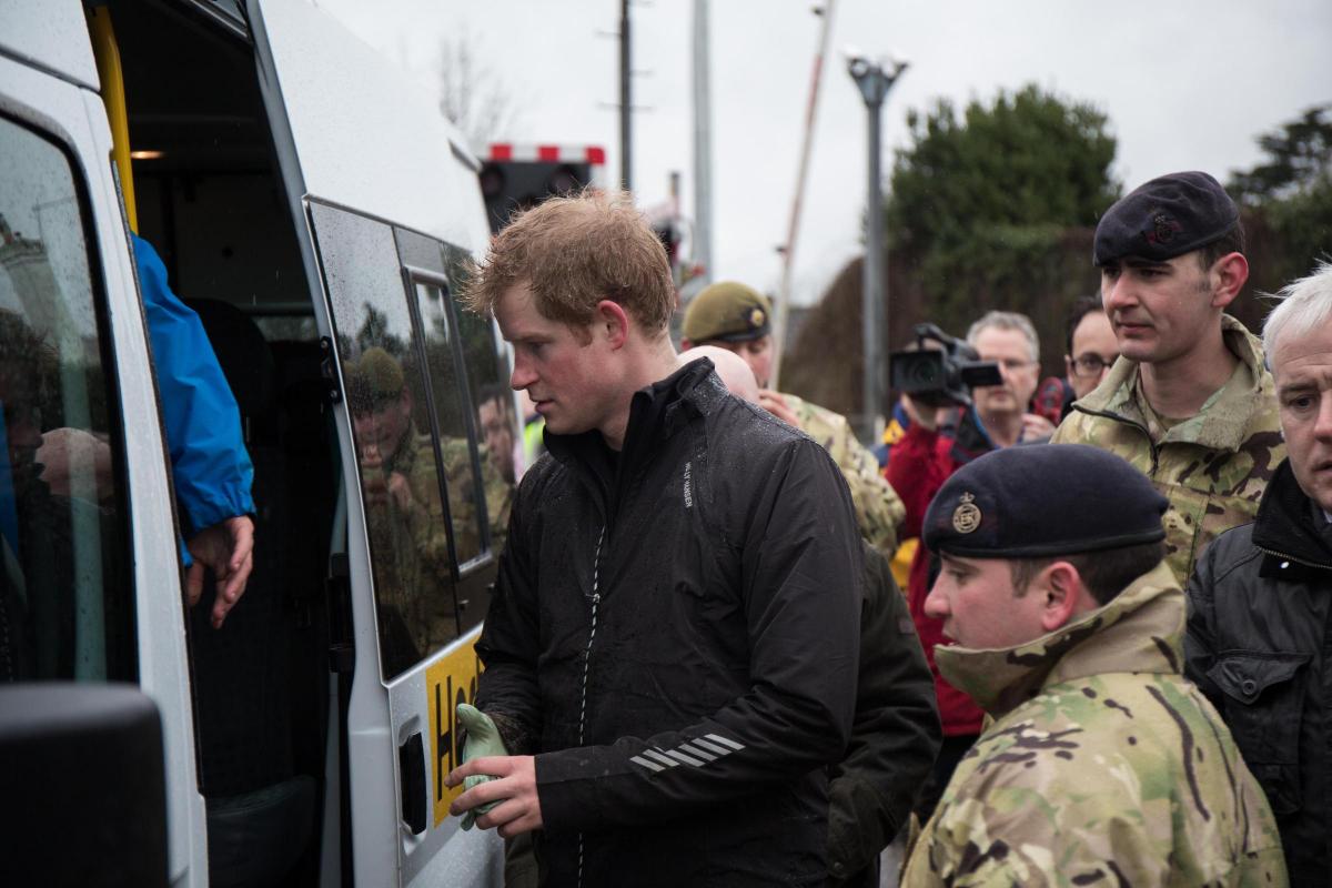 Royal flood: Princes William and Harry help out with flood defences in Berkshire
