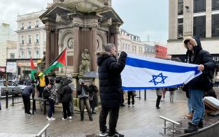 Pro-Israel and Pro-Palestine protesters facing off near the clock tower in centre Brighton.